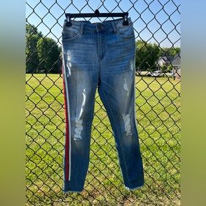 Cello jeans with red and white detailing down each pant leg, size 26 waist.